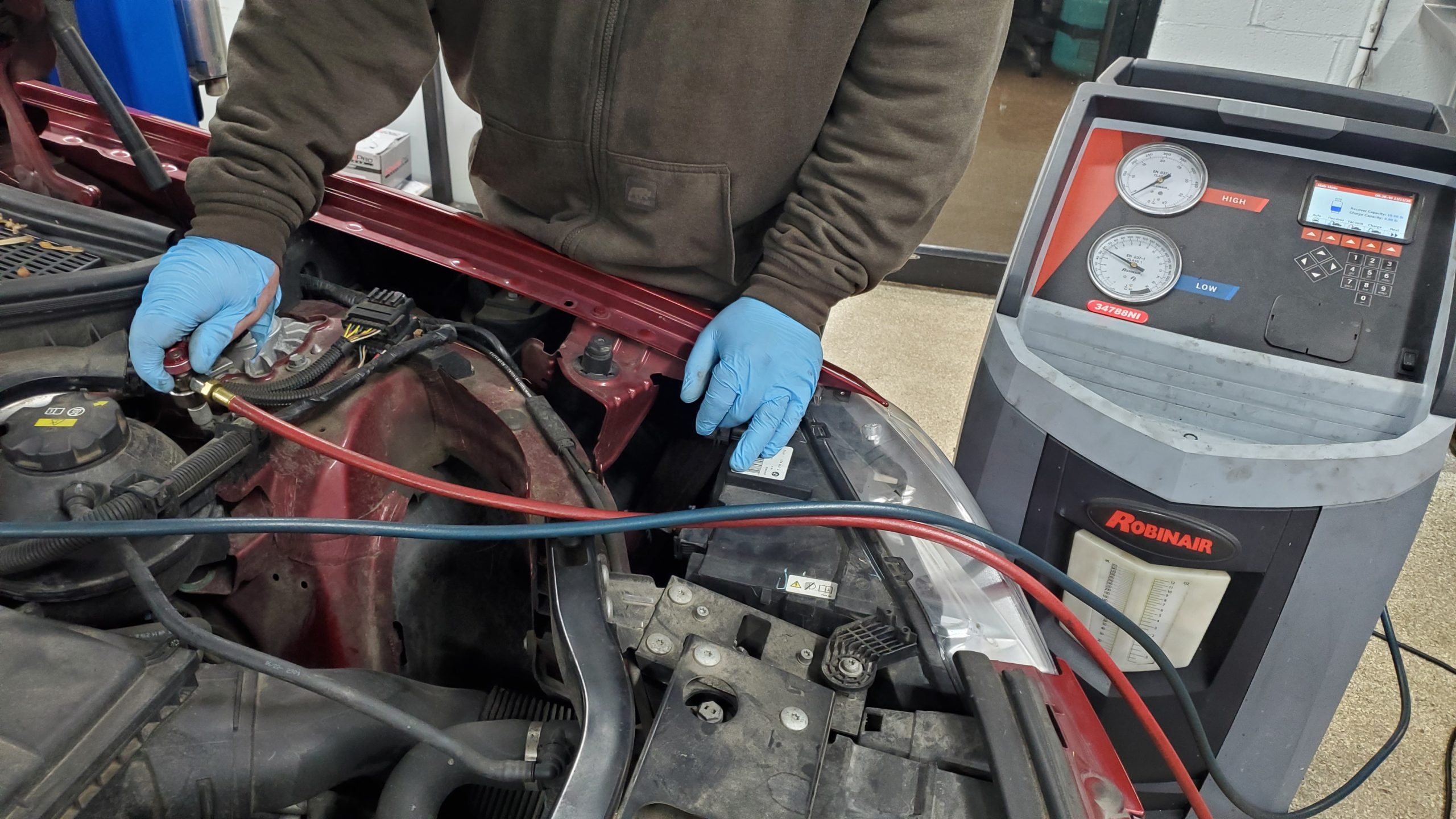 ASE-certified technician performing AC and heat repair at ER Autocare Columbus Ohio